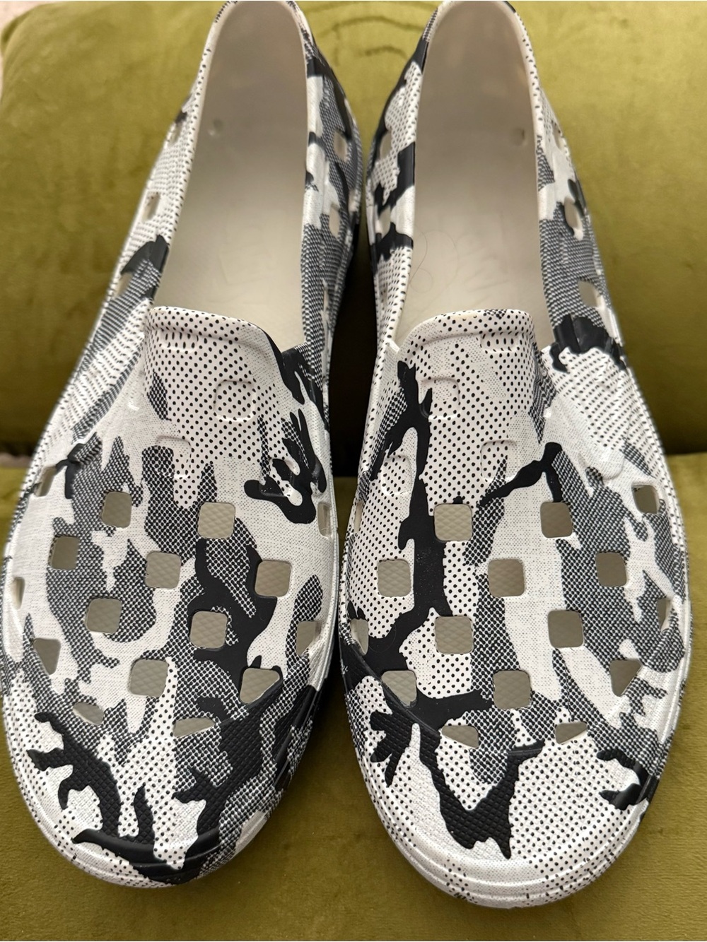 Vans White and Black Perforated Cutout Slip-Ons